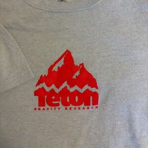 Teton Gravity - Men’s Tshirt - size Large - Light Blue Tee with Red Graphic